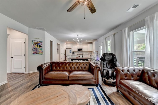 5215 Wheeler Run Dr, Auburn, GA 30011 - living area featuring a chandelier, a ceiling fan, light wood-type flooring, baseboards, and recessed lighting