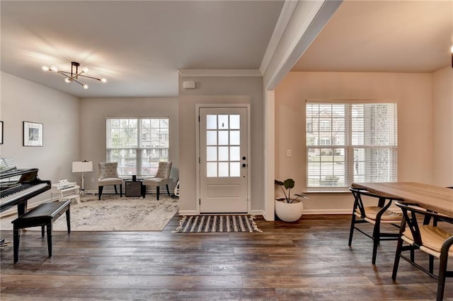 5215 Wheeler Run Dr, Auburn, GA 30011 - entryway featuring a chandelier, dark wood-type flooring, baseboards, and ornamental molding