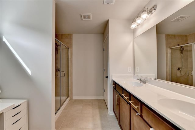 5215 Wheeler Run Dr, Auburn, GA 30011 - full bathroom featuring double vanity, a shower stall, tile patterned flooring, and baseboards