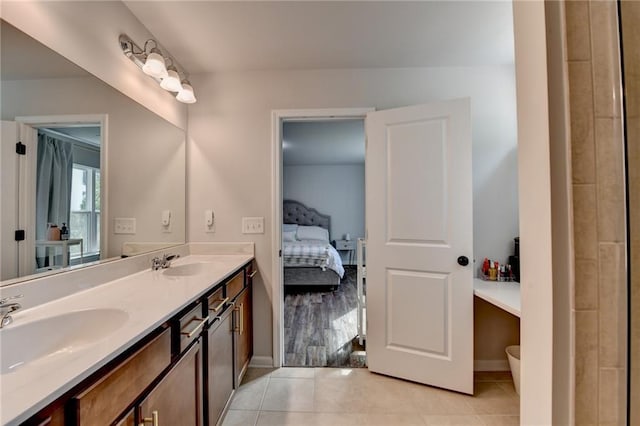5215 Wheeler Run Dr, Auburn, GA 30011 - ensuite bathroom featuring double vanity, tile patterned floors, and baseboards