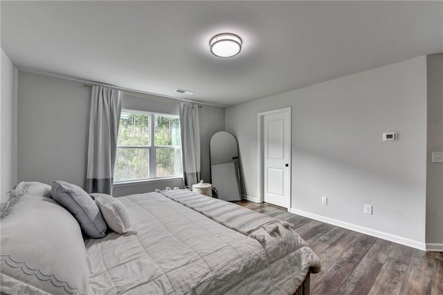 5215 Wheeler Run Dr, Auburn, GA 30011 - bedroom featuring dark wood-style flooring and baseboards