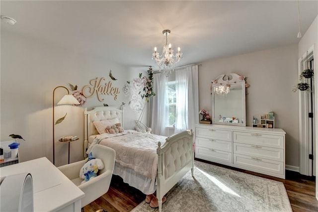 5215 Wheeler Run Dr, Auburn, GA 30011 - bedroom with a chandelier and dark wood-style flooring