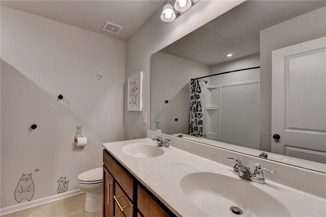 5215 Wheeler Run Dr, Auburn, GA 30011 - full bath featuring toilet, tile patterned floors, double vanity, a shower with curtain, and baseboards