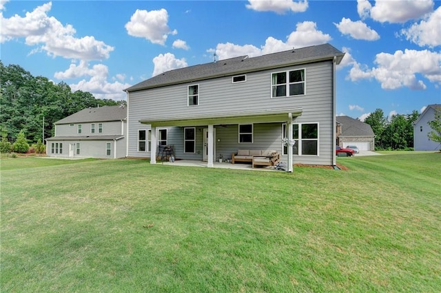 5215 Wheeler Run Dr, Auburn, GA 30011 - back of property with an outdoor hangout area, a lawn, a patio, and a garage