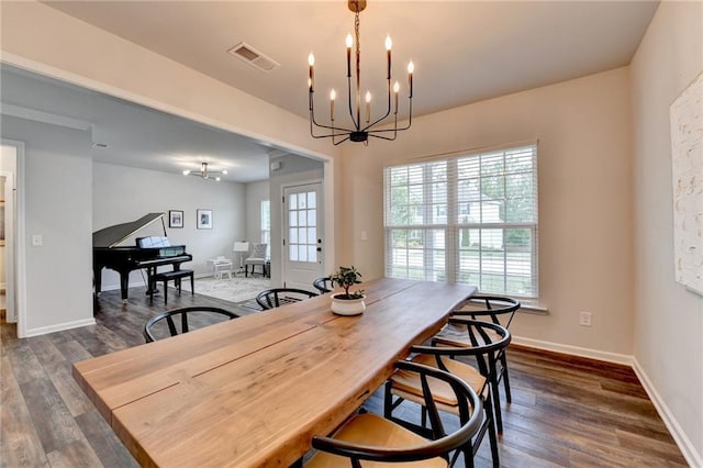 5215 Wheeler Run Dr, Auburn, GA 30011 - dining area with a chandelier, dark wood-style flooring, and baseboards