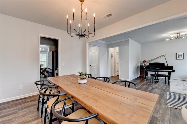 5215 Wheeler Run Dr, Auburn, GA 30011 - dining room featuring a chandelier, dark wood-style floors, and baseboards