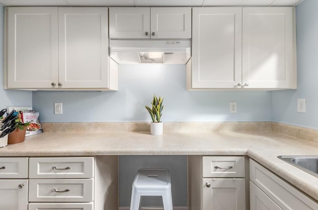 kitchen featuring white cabinetry