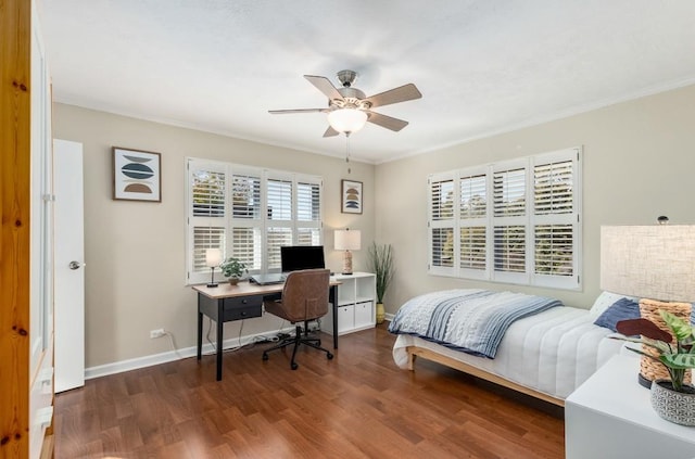 bedroom with multiple windows, dark hardwood / wood-style flooring, crown molding, and ceiling fan