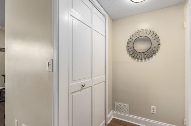 corridor featuring dark wood-type flooring