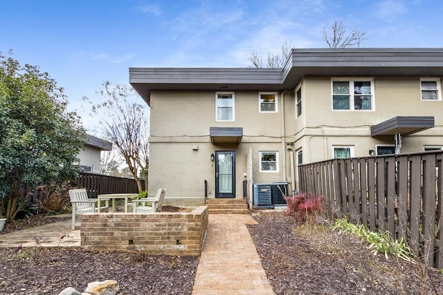 back of property featuring a patio area