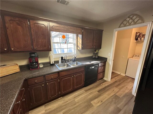 kitchen featuring light wood-type flooring, dark brown cabinetry, sink, dishwasher, and washer / dryer