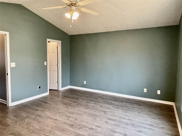 unfurnished room with baseboards, a ceiling fan, lofted ceiling, and wood finished floors