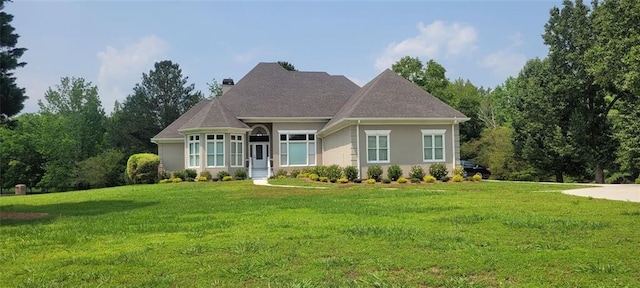 5690 Rutland Trce, Lithonia, GA 30058 - view of front facade with a chimney, a front lawn, and stucco siding