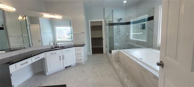5690 Rutland Trce, Lithonia, GA 30058 - full bathroom featuring a marble finish shower, marble look tiles, vanity, a jetted tub, and a spacious closet