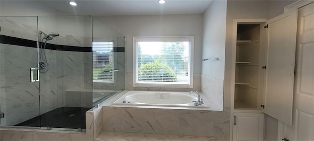 5690 Rutland Trce, Lithonia, GA 30058 - bathroom featuring a bath, a marble finish shower, recessed lighting, and a closet