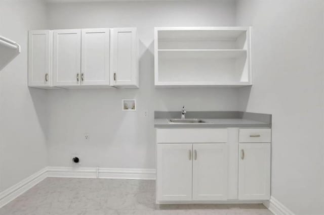 5690 Rutland Trce, Lithonia, GA 30058 - laundry area featuring washer hookup, cabinet space, electric dryer hookup, and gas dryer hookup