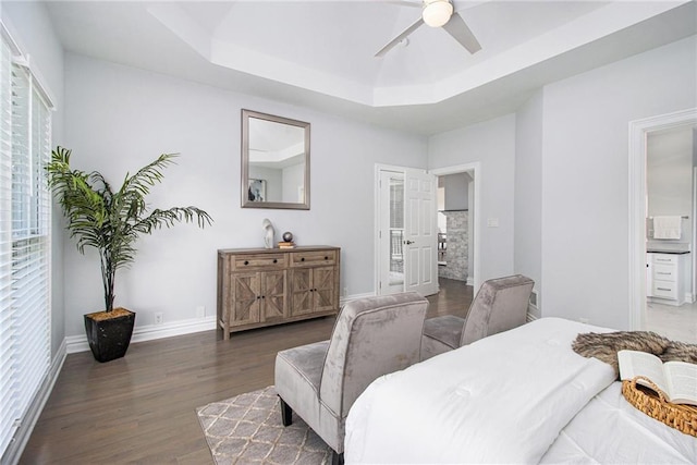5690 Rutland Trce, Lithonia, GA 30058 - bedroom featuring a tray ceiling, wood finished floors, connected bathroom, and ceiling fan