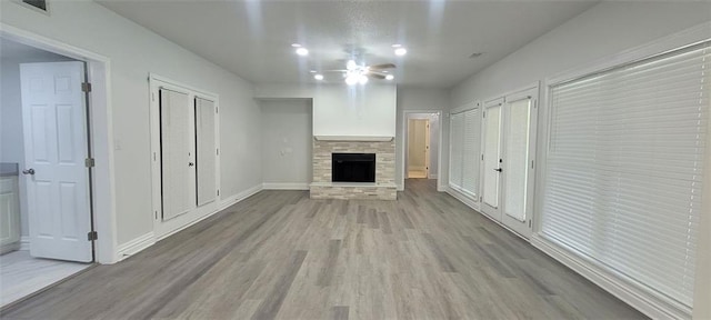 5690 Rutland Trce, Lithonia, GA 30058 - unfurnished living room featuring wood finished floors, a fireplace, and recessed lighting