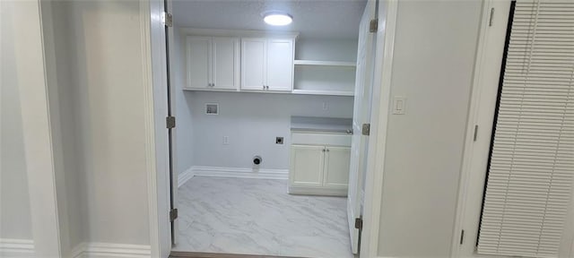 5690 Rutland Trce, Lithonia, GA 30058 - laundry area featuring electric dryer hookup, cabinet space, washer hookup, and marble finish floors