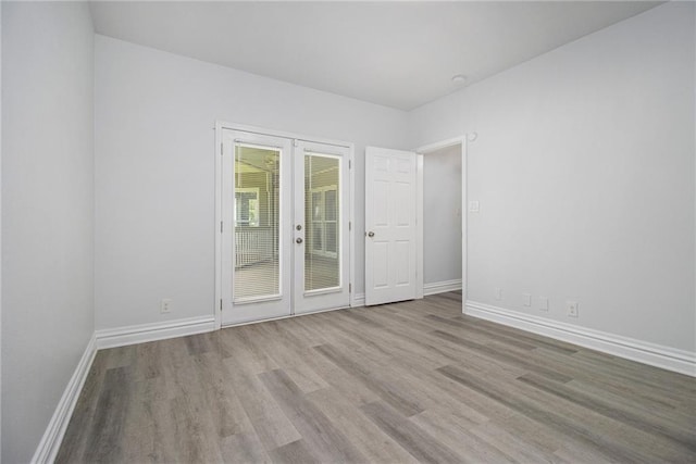 5690 Rutland Trce, Lithonia, GA 30058 - unfurnished room featuring wood finished floors and french doors