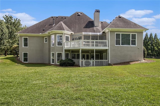 5690 Rutland Trce, Lithonia, GA 30058 - rear view of house with stucco siding, a sunroom, a chimney, and a yard