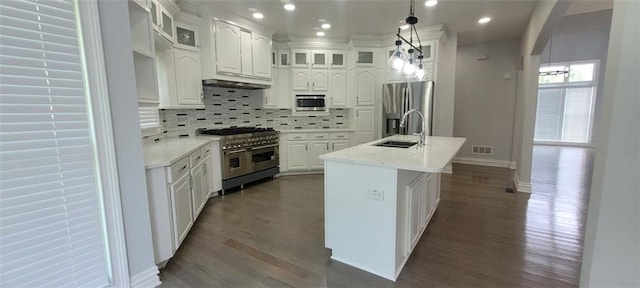 5690 Rutland Trce, Lithonia, GA 30058 - kitchen with stainless steel appliances, dark wood-style flooring, backsplash, white cabinets, and recessed lighting
