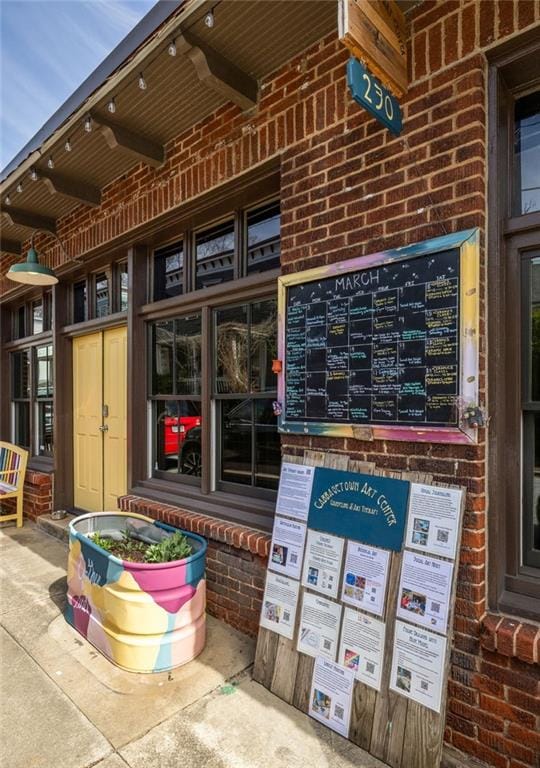 exterior space featuring brick siding