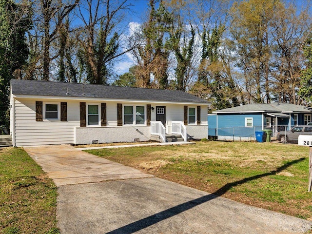 single story home with concrete driveway, crawl space, and a front lawn