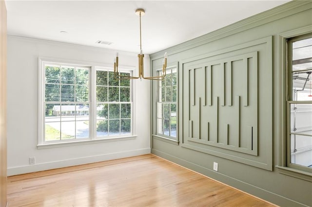 762 Rockbridge Rd NW, Lilburn, GA 30047 - empty room featuring baseboards, wood finished floors, and crown molding