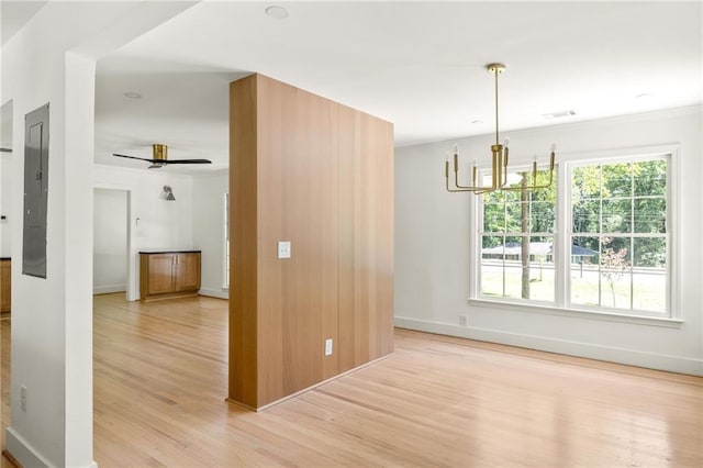762 Rockbridge Rd NW, Lilburn, GA 30047 - spare room with light wood-type flooring, a chandelier, baseboards, and ceiling fan