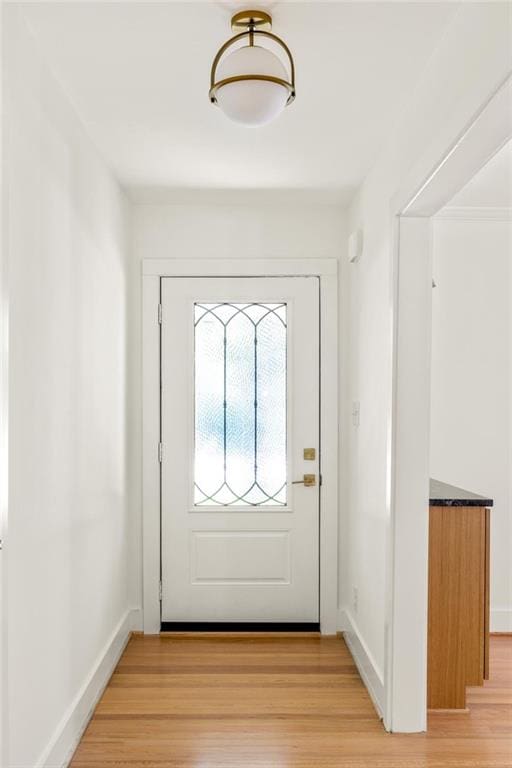762 Rockbridge Rd NW, Lilburn, GA 30047 - doorway to outside with light wood-type flooring and baseboards