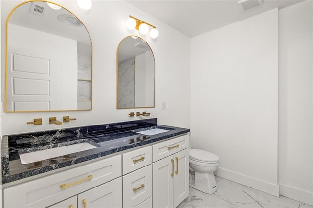 762 Rockbridge Rd NW, Lilburn, GA 30047 - full bath with marble look tile flooring, double vanity, toilet, and baseboards