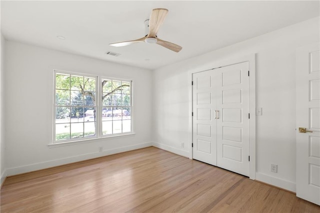 762 Rockbridge Rd NW, Lilburn, GA 30047 - unfurnished bedroom featuring baseboards, light wood finished floors, and a ceiling fan