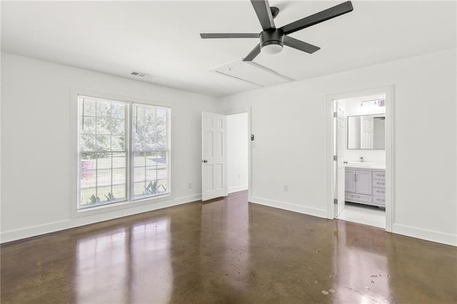 762 Rockbridge Rd NW, Lilburn, GA 30047 - unfurnished bedroom with concrete floors, baseboards, ensuite bath, and ceiling fan