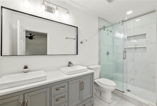 762 Rockbridge Rd NW, Lilburn, GA 30047 - bathroom featuring marble finish floors, a marble finish shower, double vanity, toilet, and a ceiling fan