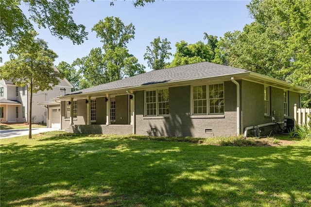 762 Rockbridge Rd NW, Lilburn, GA 30047 - ranch-style home featuring a front lawn, a garage, brick siding, and concrete driveway