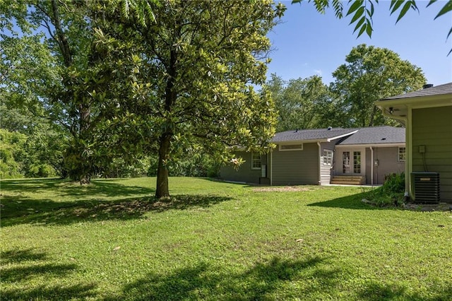 762 Rockbridge Rd NW, Lilburn, GA 30047 - view of grassy yard with central air condition unit