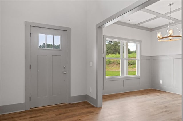 entrance foyer featuring a notable chandelier and hardwood / wood-style flooring