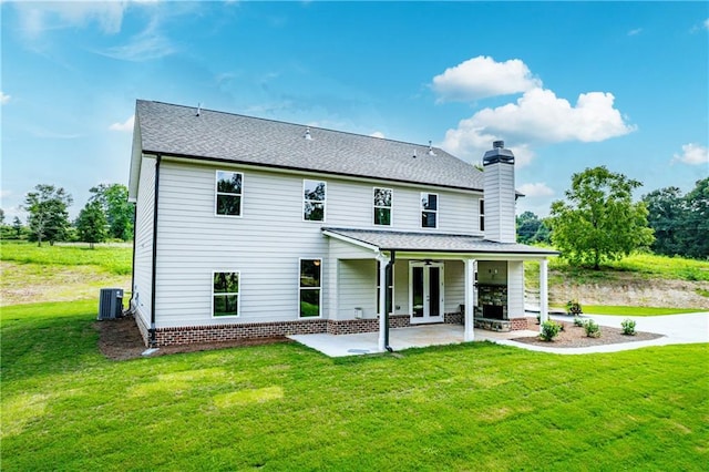 back of house with cooling unit, ceiling fan, a yard, and a patio