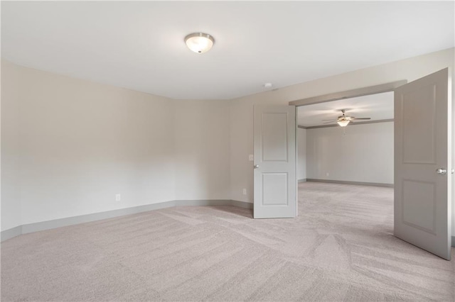 unfurnished room with light carpet