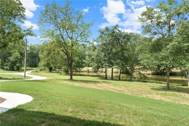 view of home's community featuring a lawn