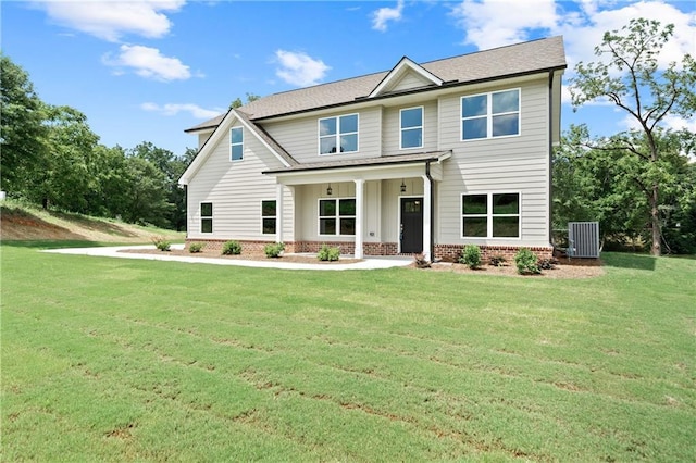 craftsman-style house with cooling unit, a porch, and a front lawn