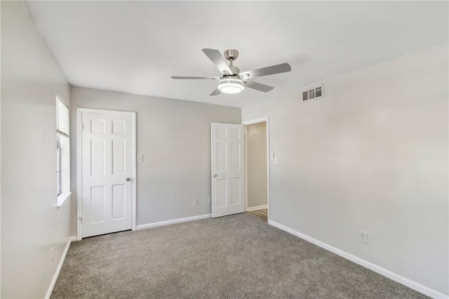 6429 Woodstone Way, Morrow, GA 30260 - unfurnished bedroom with baseboards, carpet, ceiling fan, and multiple windows