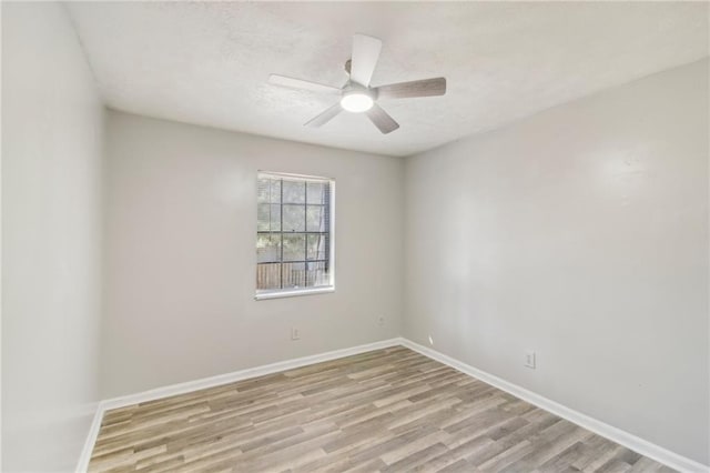 6429 Woodstone Way, Morrow, GA 30260 - empty room with light wood finished floors, baseboards, and ceiling fan