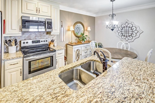 kitchen with stainless steel appliances, decorative backsplash, a sink, and crown molding