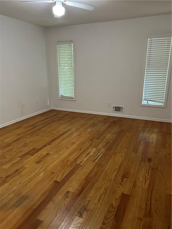 4968 Twin Branches Way, Dunwoody, GA 30338 - spare room with wood finished floors and ceiling fan
