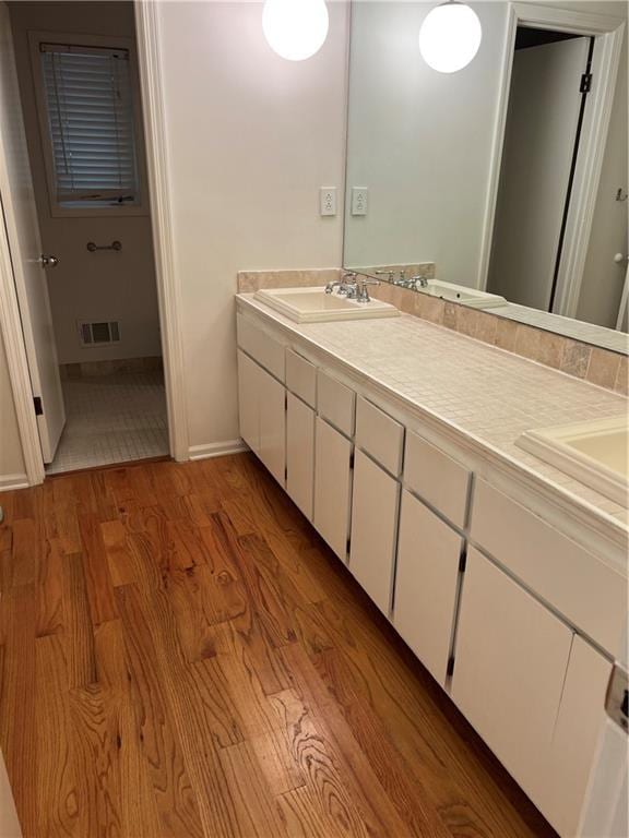 4968 Twin Branches Way, Dunwoody, GA 30338 - bathroom with wood finished floors and double vanity