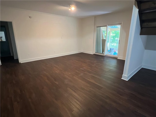 4968 Twin Branches Way, Dunwoody, GA 30338 - unfurnished living room with dark wood-style floors and baseboards