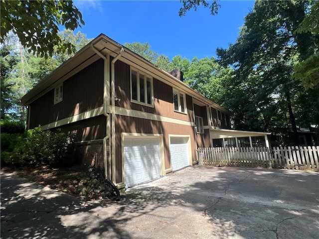 4968 Twin Branches Way, Dunwoody, GA 30338 - view of front of property with an attached garage and concrete driveway