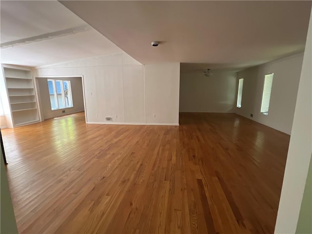 4968 Twin Branches Way, Dunwoody, GA 30338 - empty room featuring light wood-type flooring, beam ceiling, and built in features